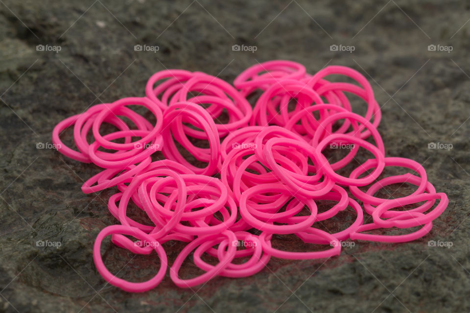 High angle view of pink rubber band