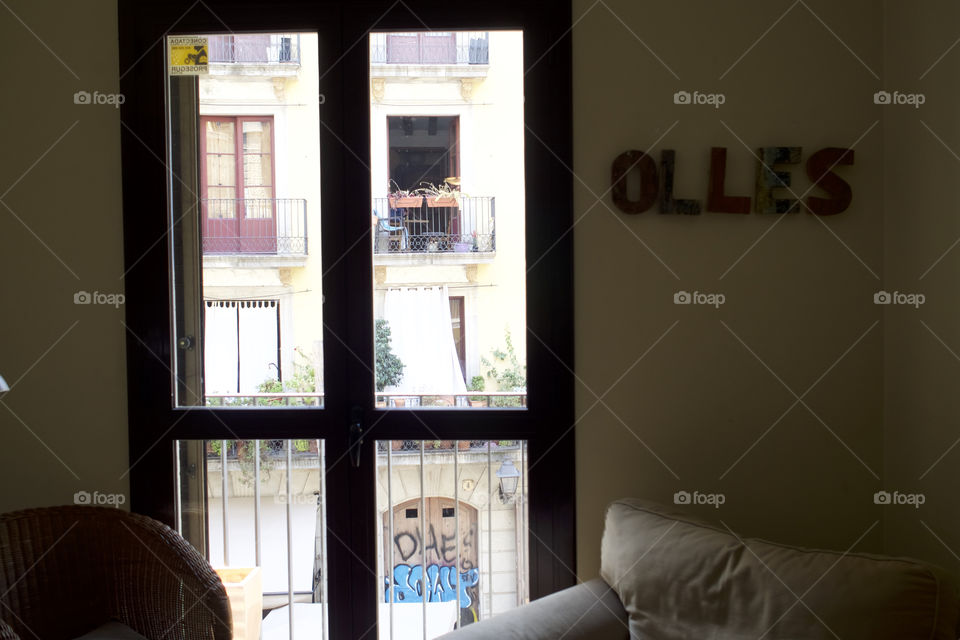 Window view, looking through to the Gothic quarter of Barcelona Spain