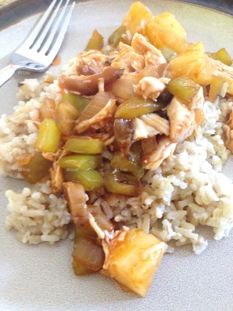 Sweet and Sour Pineapple Chicken Served Over Brown Rice