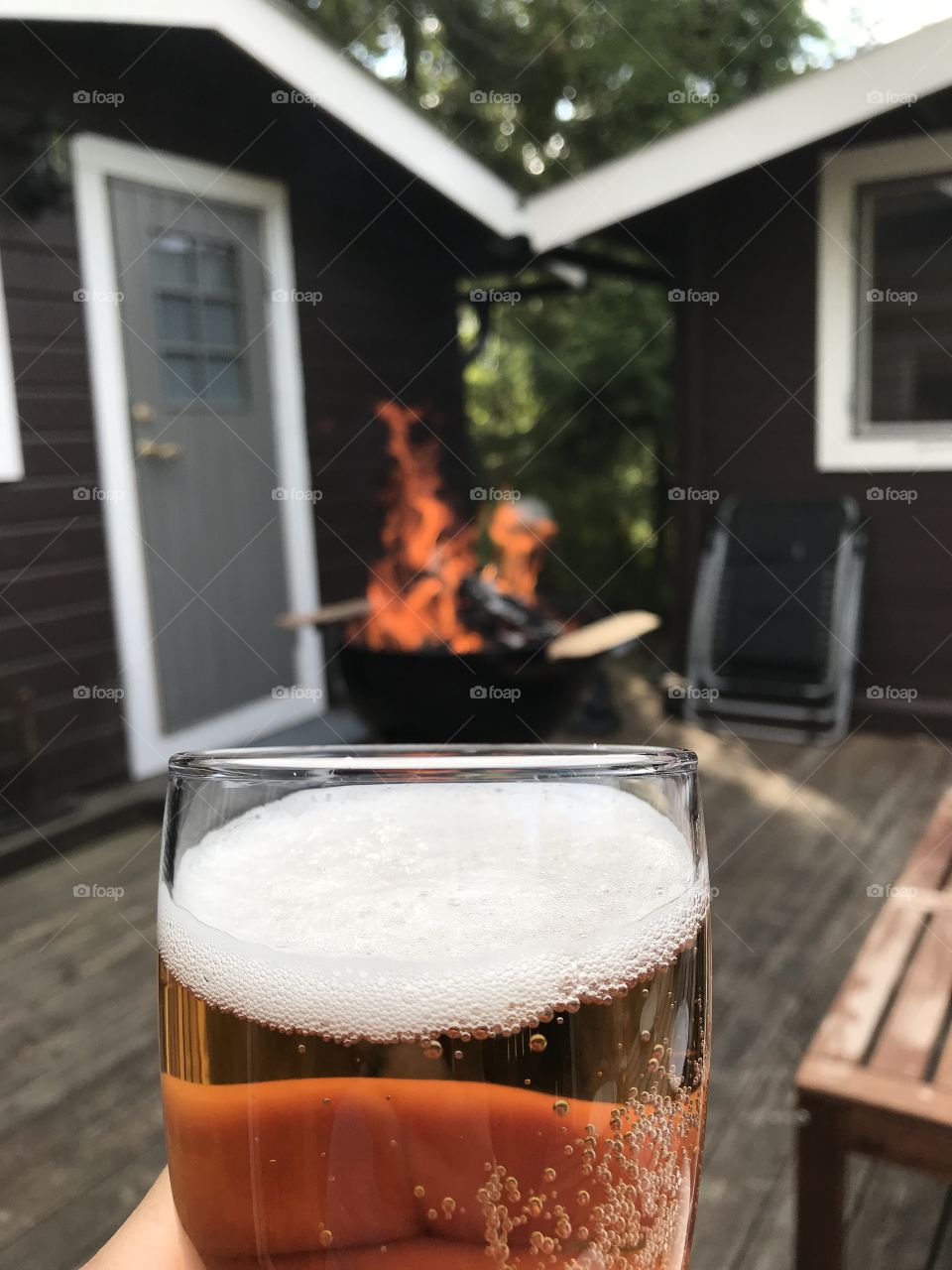 Drinking beer over a fire