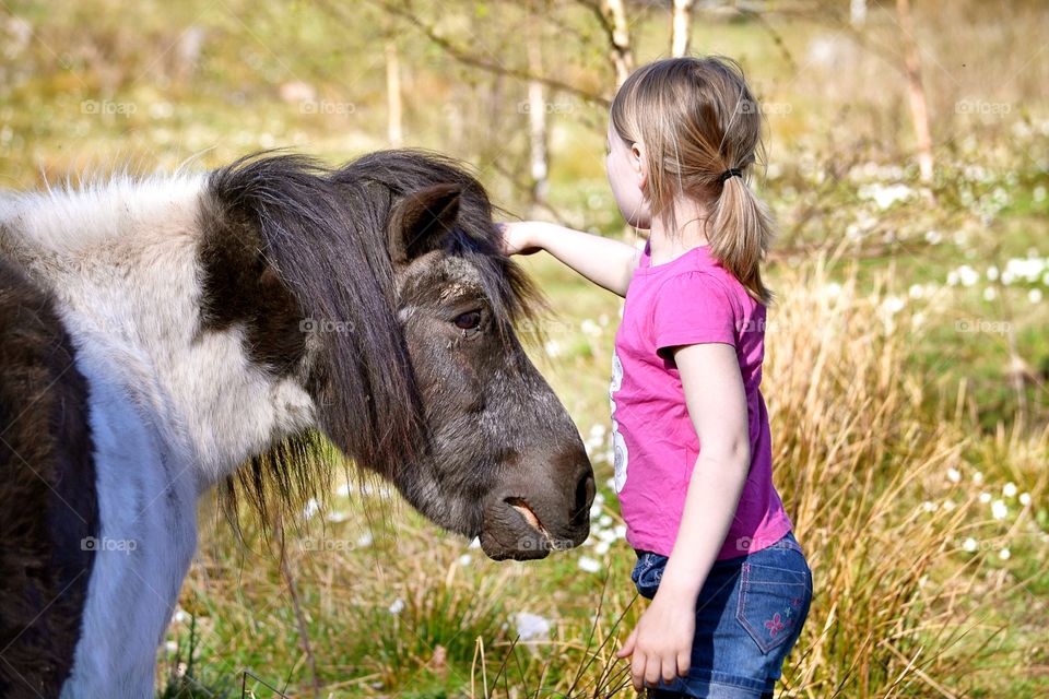 Child with a pony