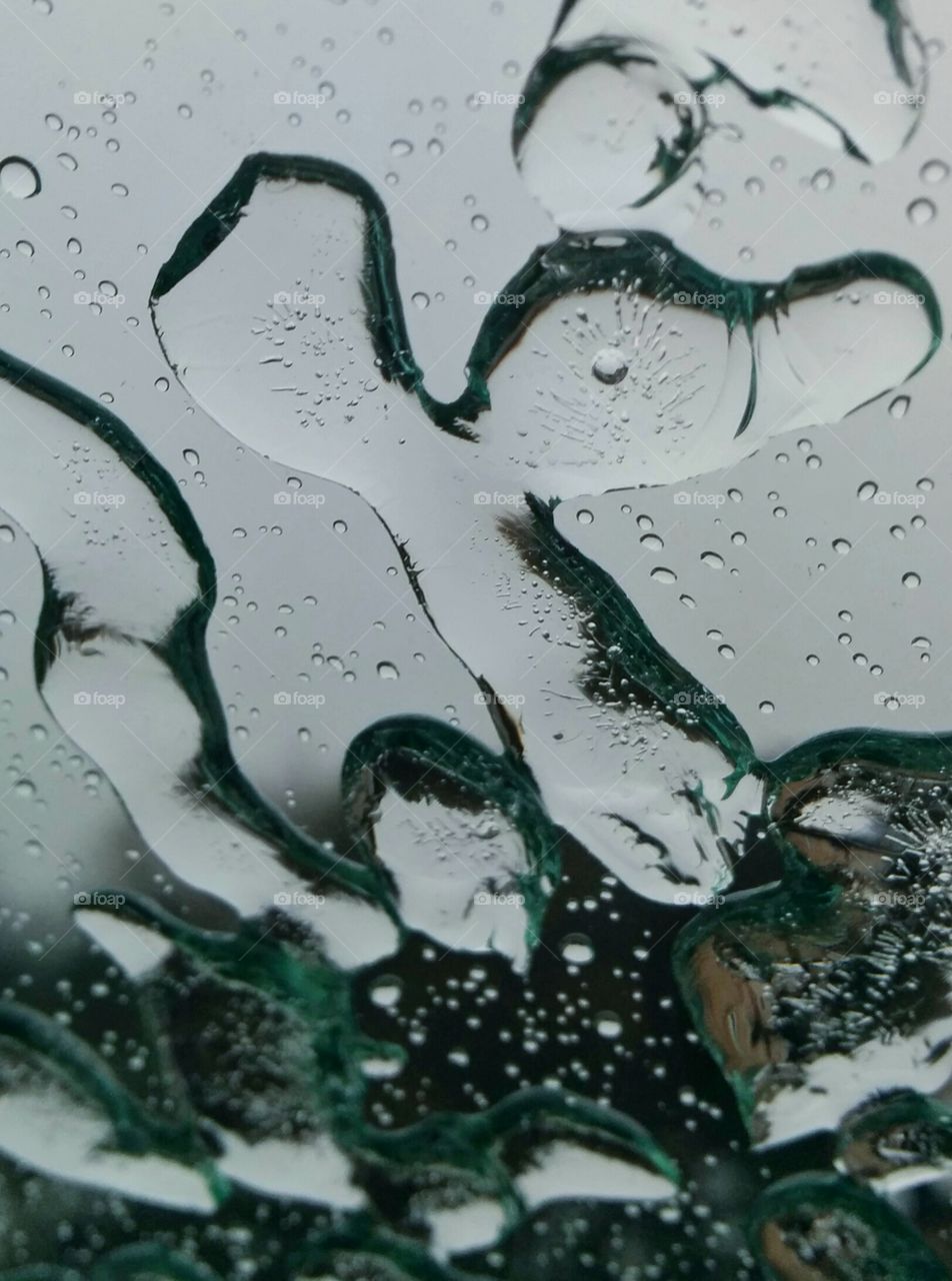 streaks of ice on a vehicle windshield