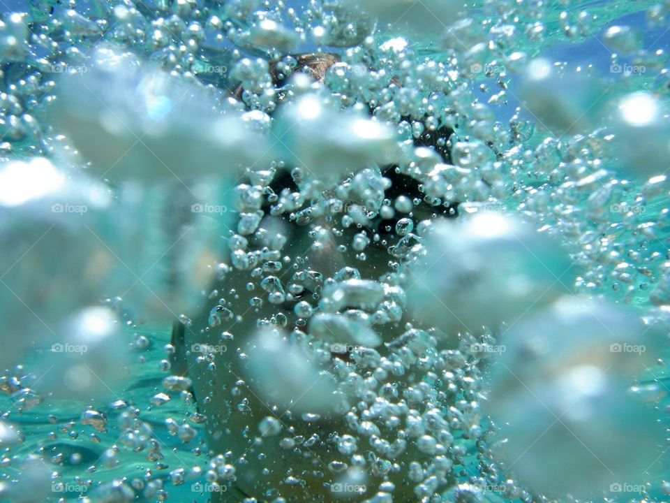Close-up of Underwater person with bubbles