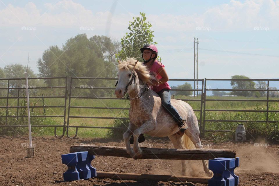 This kid has NO FEAR when it comes to riding horses or ponies, she's already been jumping most of the ones she's owned, including this beautiful creature!