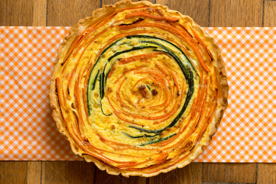 A colourful savoury tart made with carrots and courgette