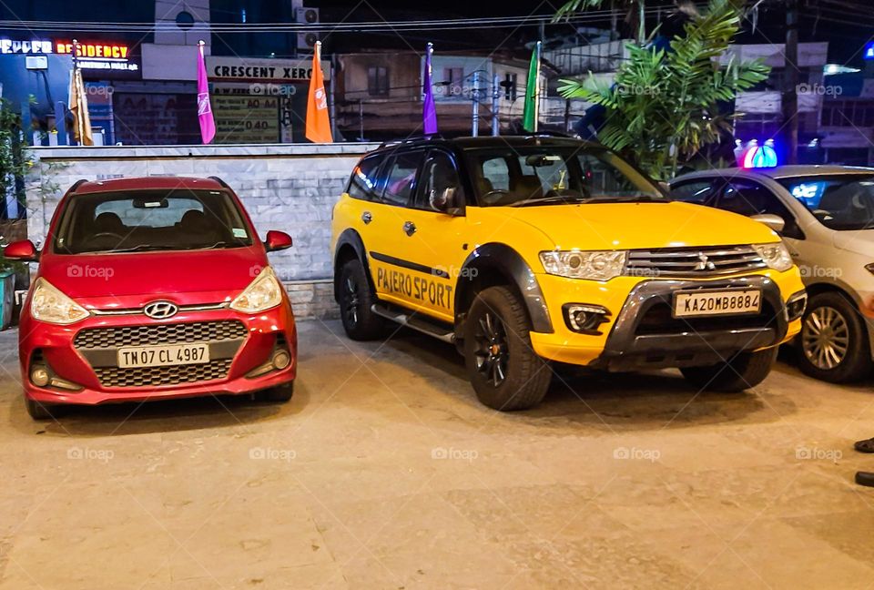 Yellow Sports Car and a Red Car