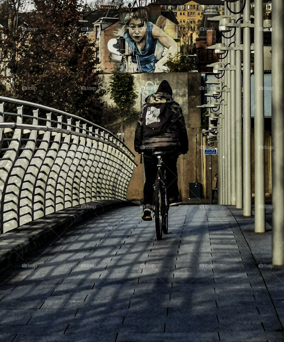 A man on the bike and shadows