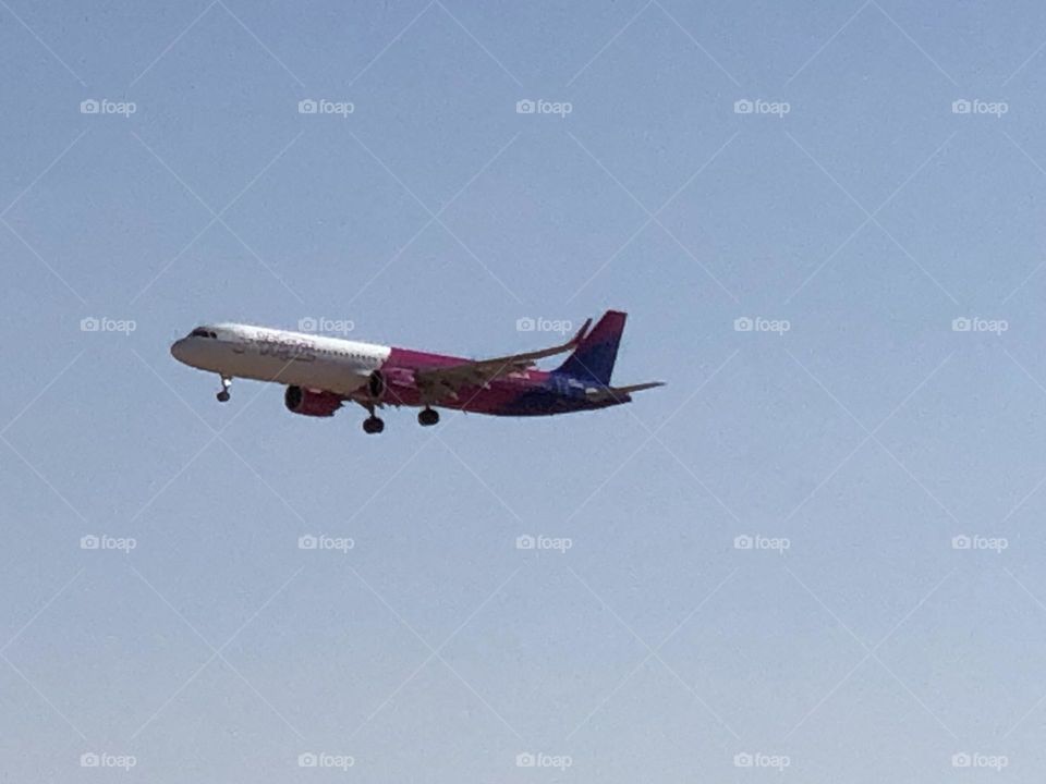 beautiful aircraft flying cross the blue sky