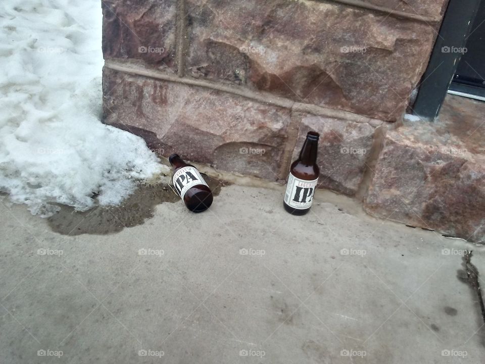 two empty beer beer bottles
