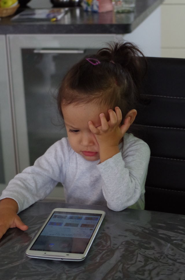 Girl sitting on chair with mobile phone