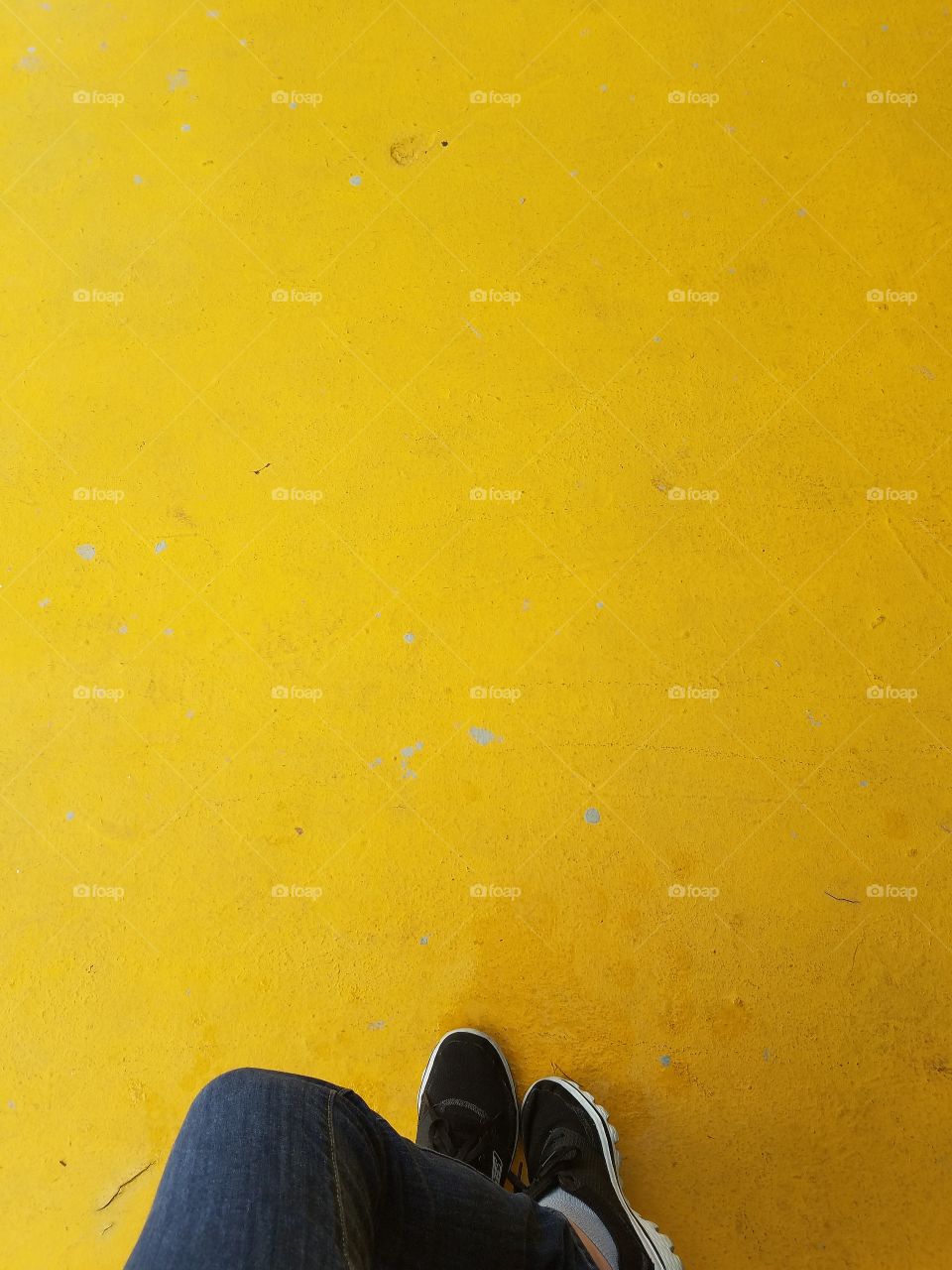 Shoes on Yellow Pavement