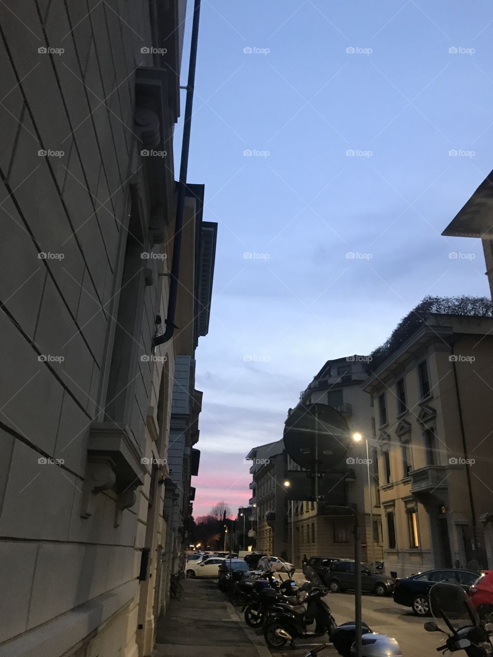 Beautiful sky gradient in between buildings in Florence, Italy.