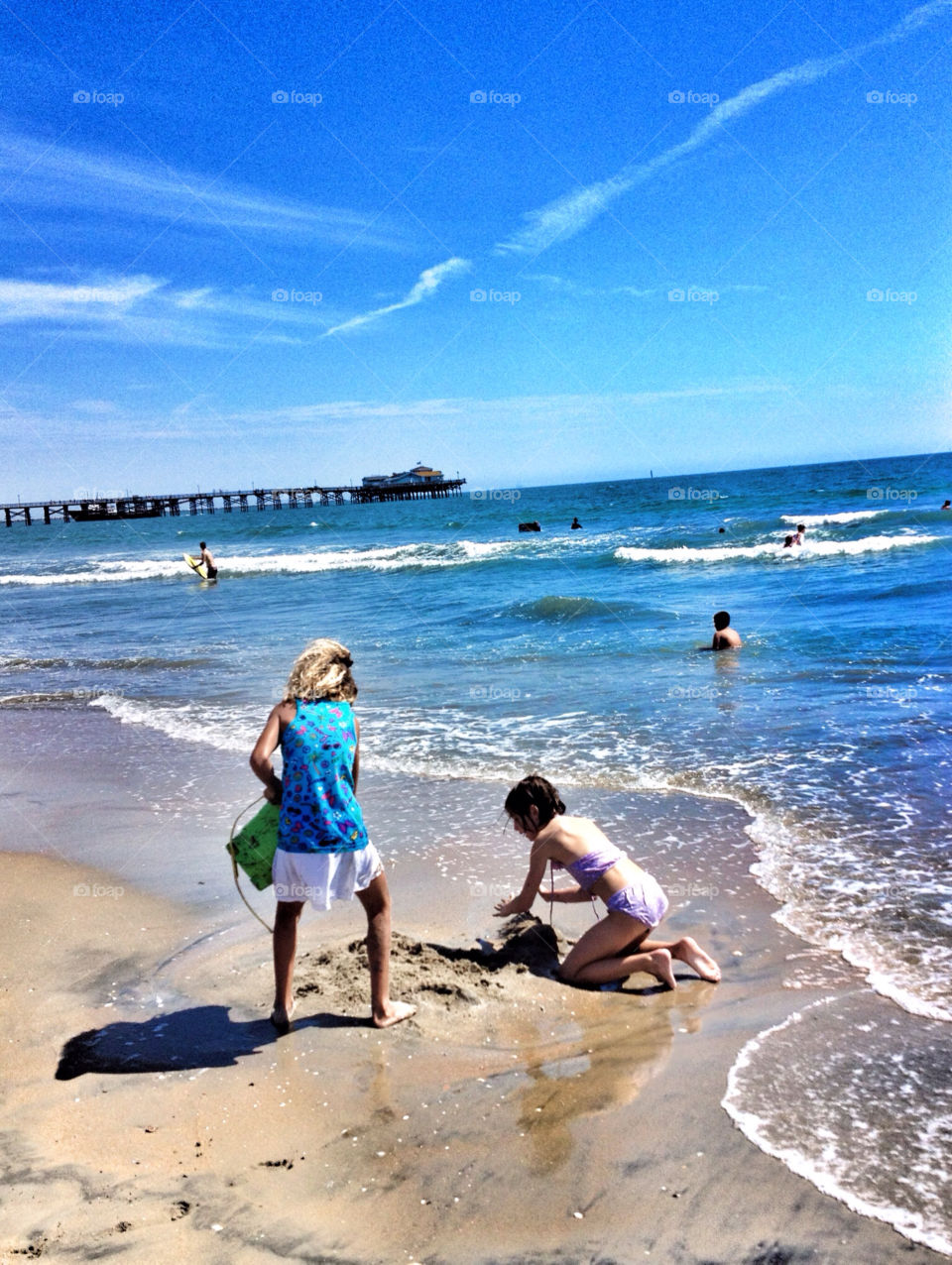 beach summer child playing by analia