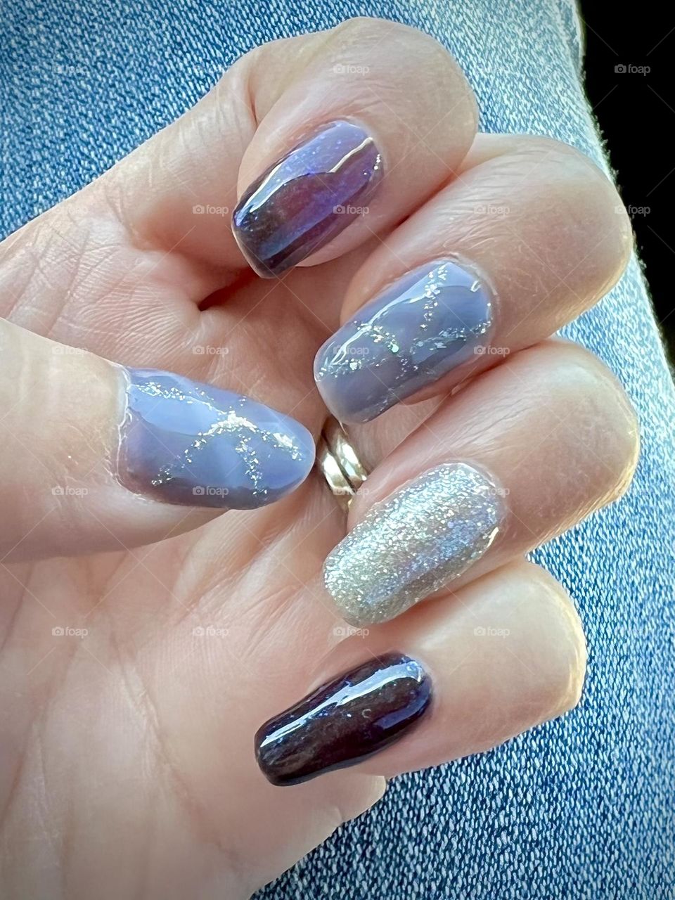 Complimenting colored nails with purple, silver sparkly, color-changing nail art design 