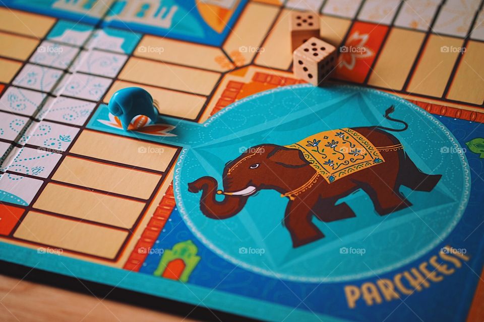 Parcheesi Indian board game, classic board games, pawns of the board game, Parcheesi at home, family time at home, playing board games, roll the dice, playing Parcheesi, quality time at home