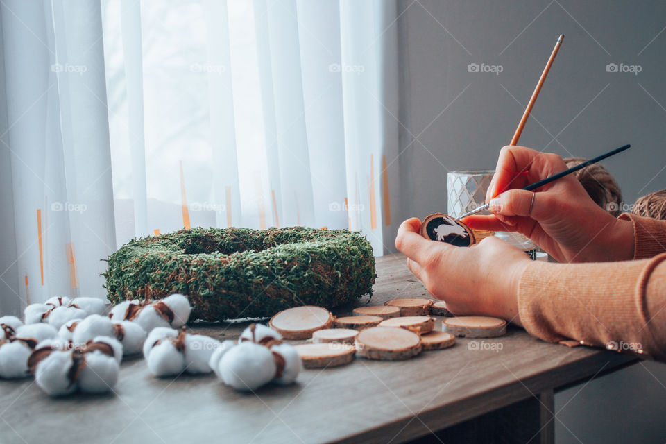 photo of a woman crafting an Easter wreath made only from eco friendly materials