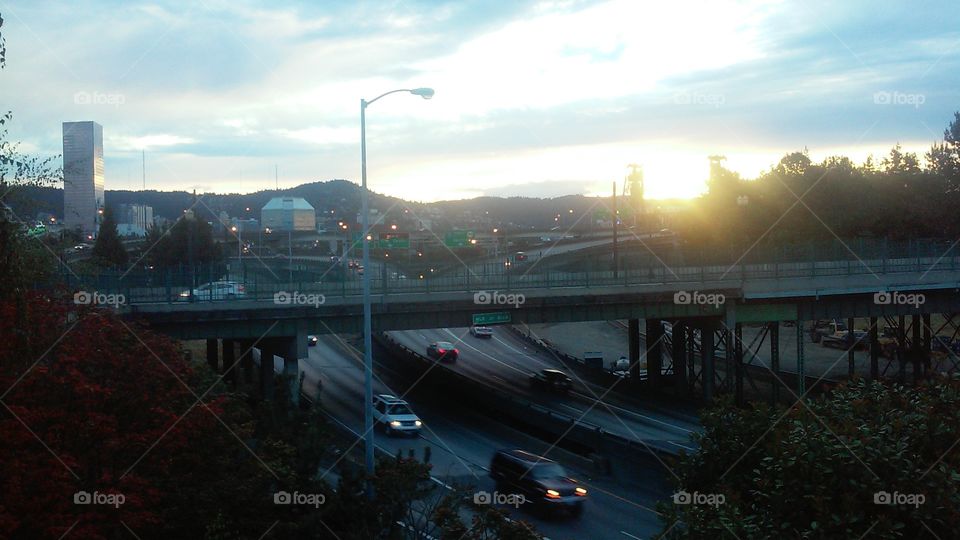 Sunstream Commute. The last drops of sunshine make their way through Steelbridge in Portland, OR