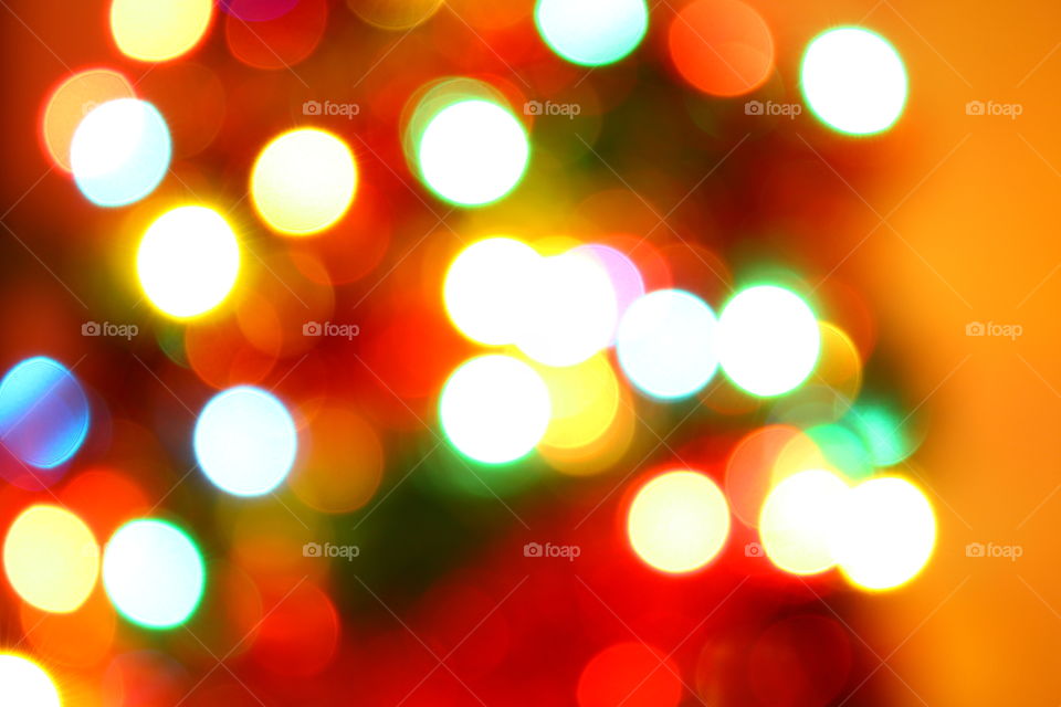 Macro shot of Christmas tree decorations and vivid lights