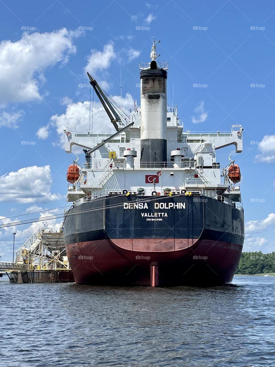  Cargo Ship docked being unloaded 