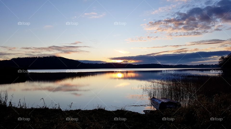 Beach and sunset reflection in mirror lake 