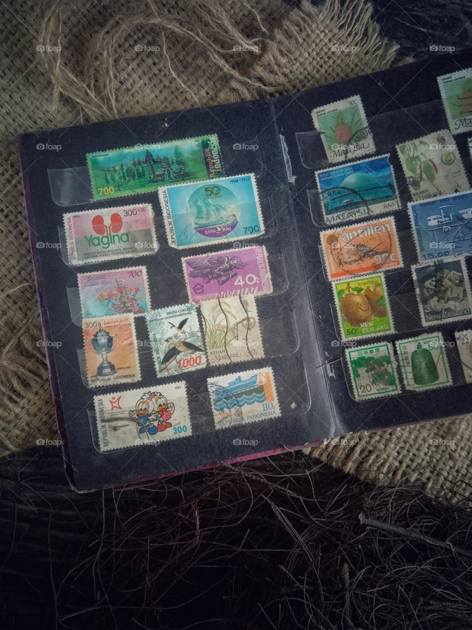 A stamp is a label or piece of paper that has a certain shape and size, either with or without a picture.