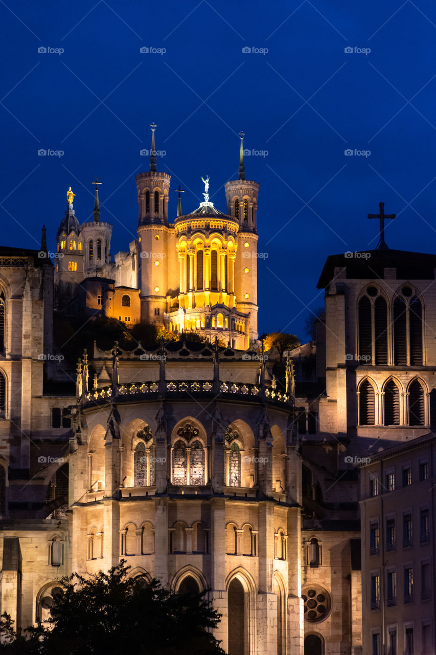 Basilica of Notre Dame De Fourviere photo taken at night with lights on.