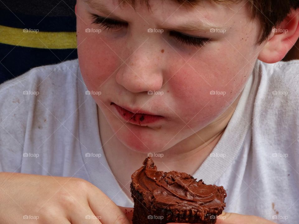 Boy eating cupcake