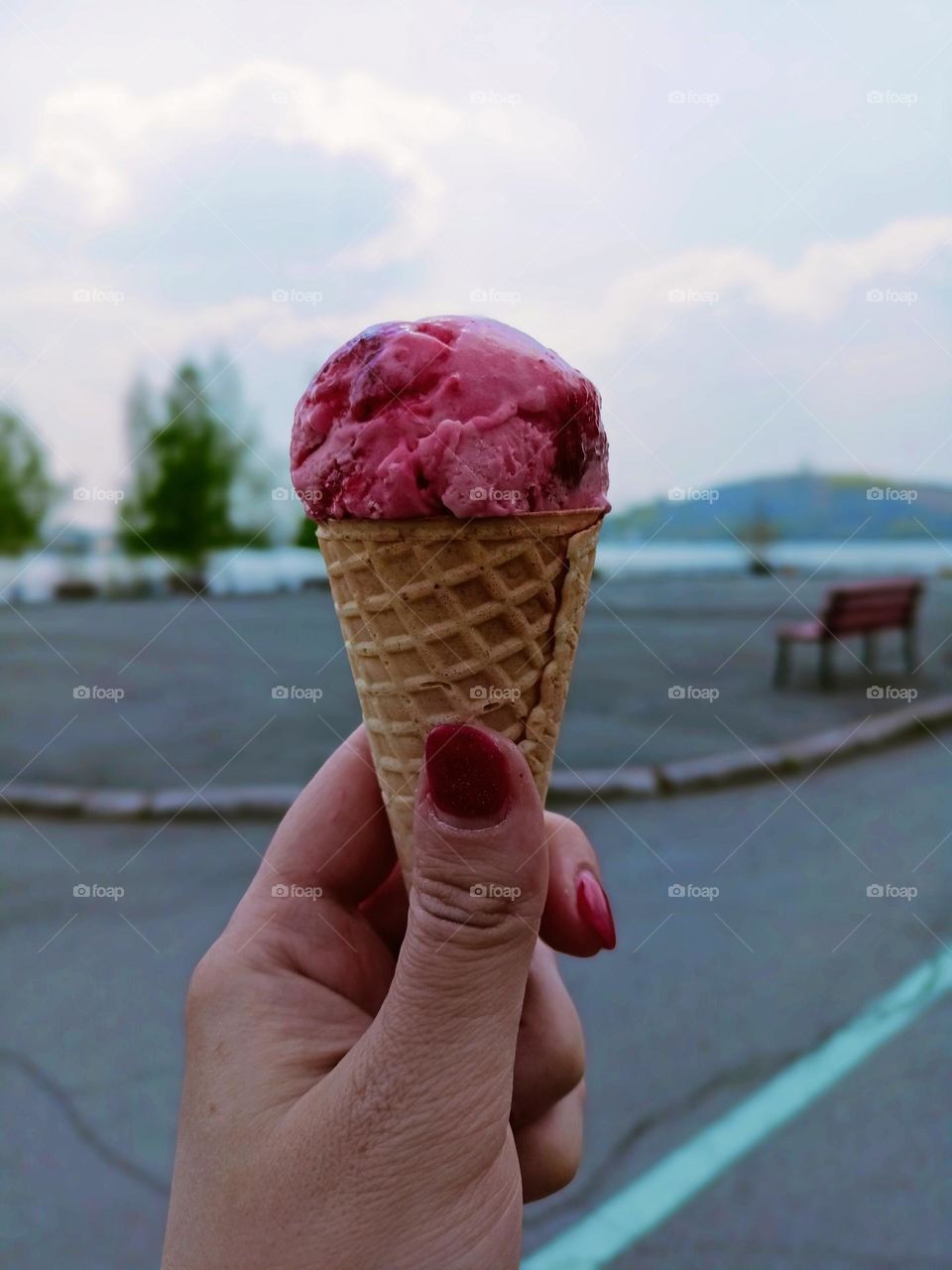 Picnic in the park, strawberry ice cream in a waffle cup, cityscape, food, ice cream, pink color, may, sunny day, park, sky, female hand, manicure