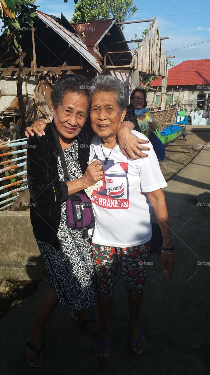 the two old ladies enjoying taken photo.