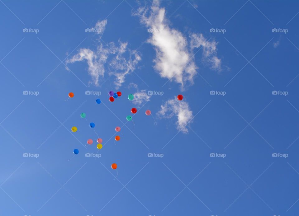 colour balloons in the blue sky clouds