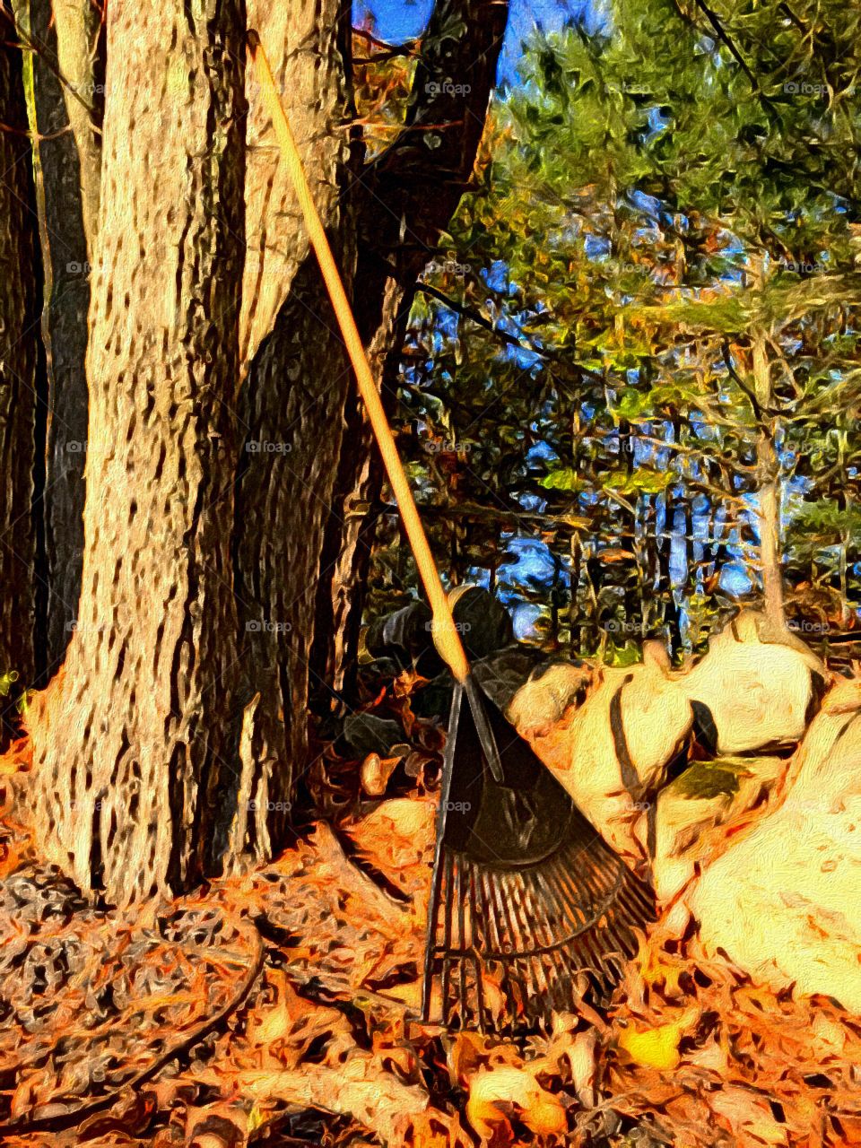 Raking the leaves. This picture was enhanced with brush stroke iPhone app which makes photographs look like paintings.
