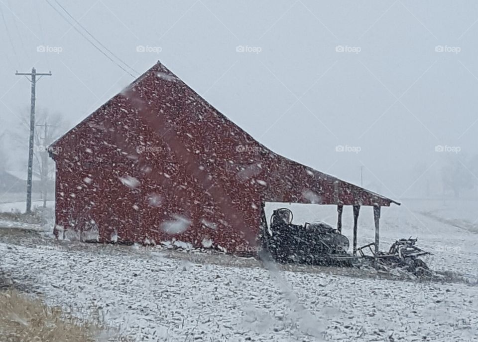 snowy red barn