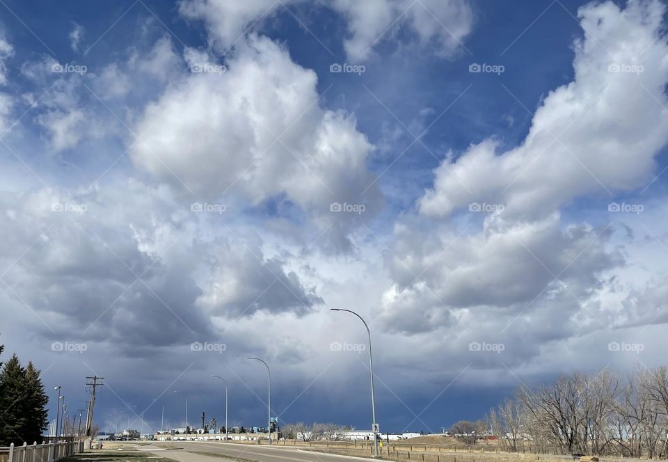 A nasty storm is coming from the looks of these clouds just past a small Alberta town