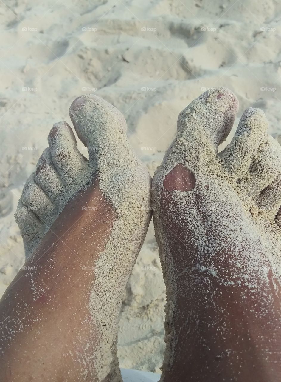 sandy feet with a heart impression