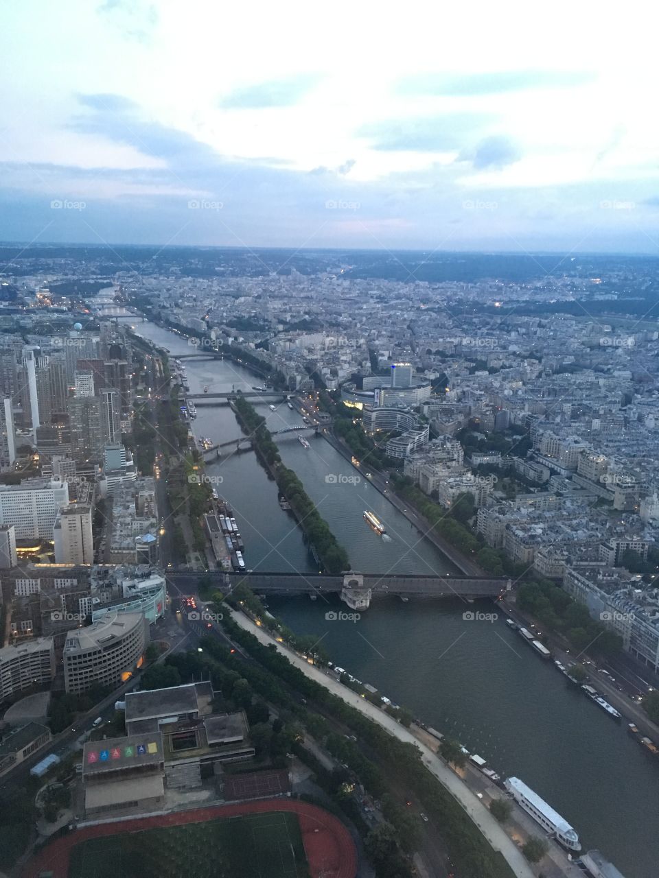 A view of the Seine River atop the Eiffel Tower in Paris, just as the sun begins to go down
