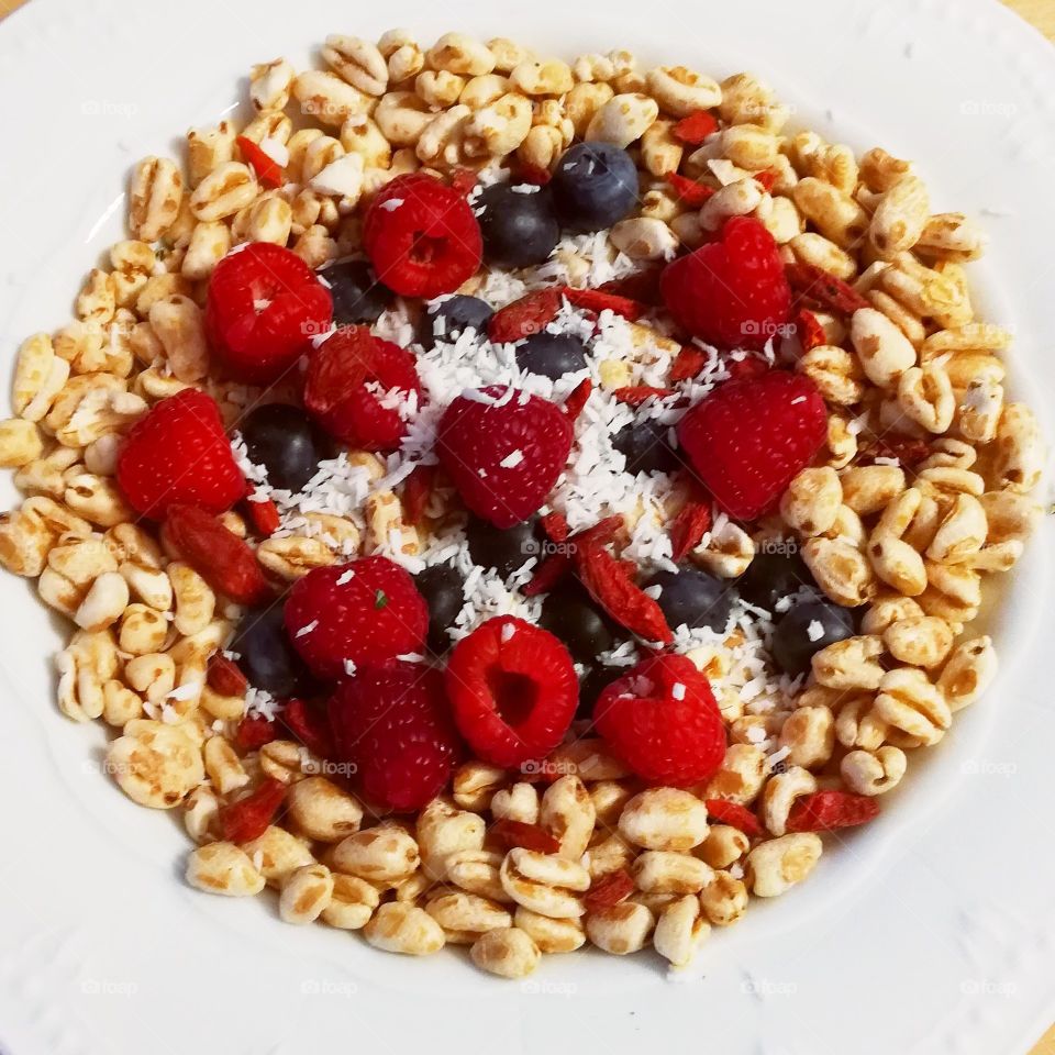 Juicy red fruit cereal breakfast bowl