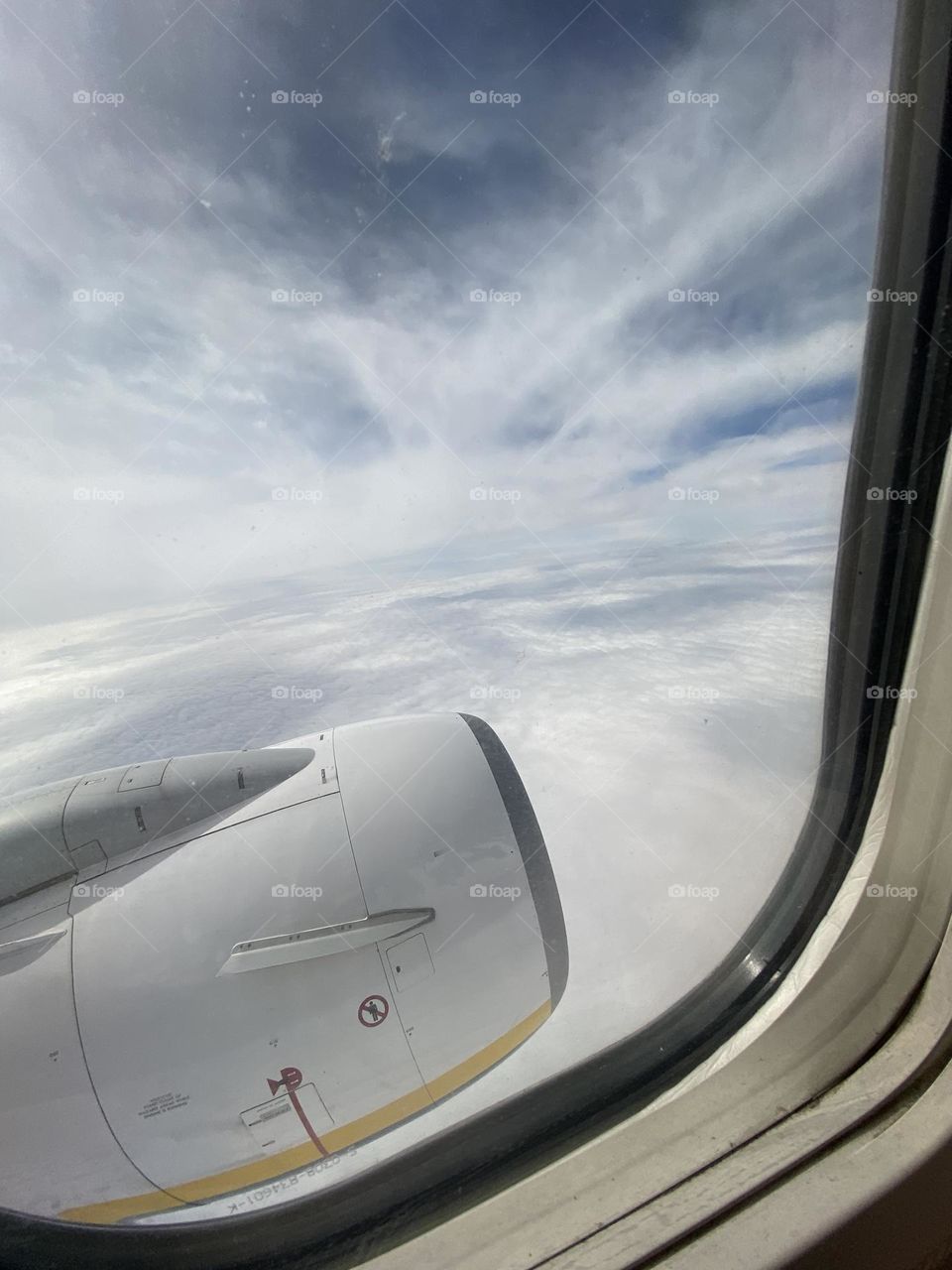 Clouds through the window of plane 