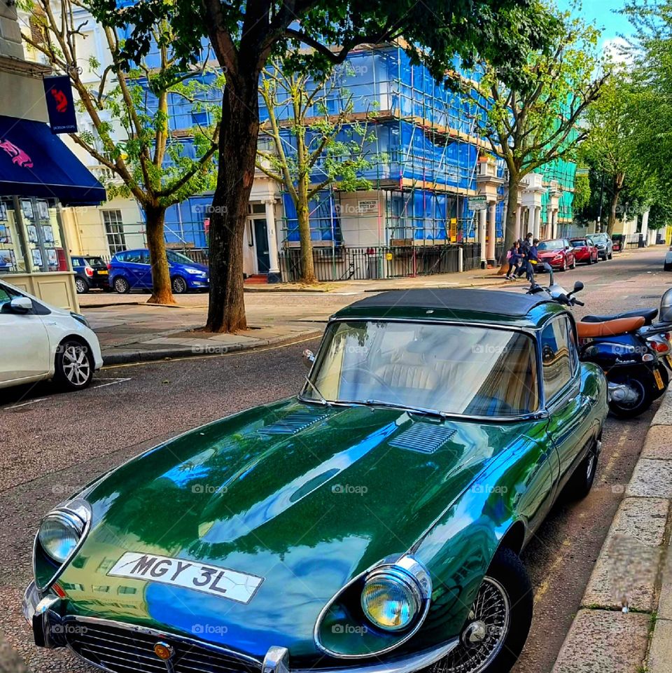 green old car with soul on London's street