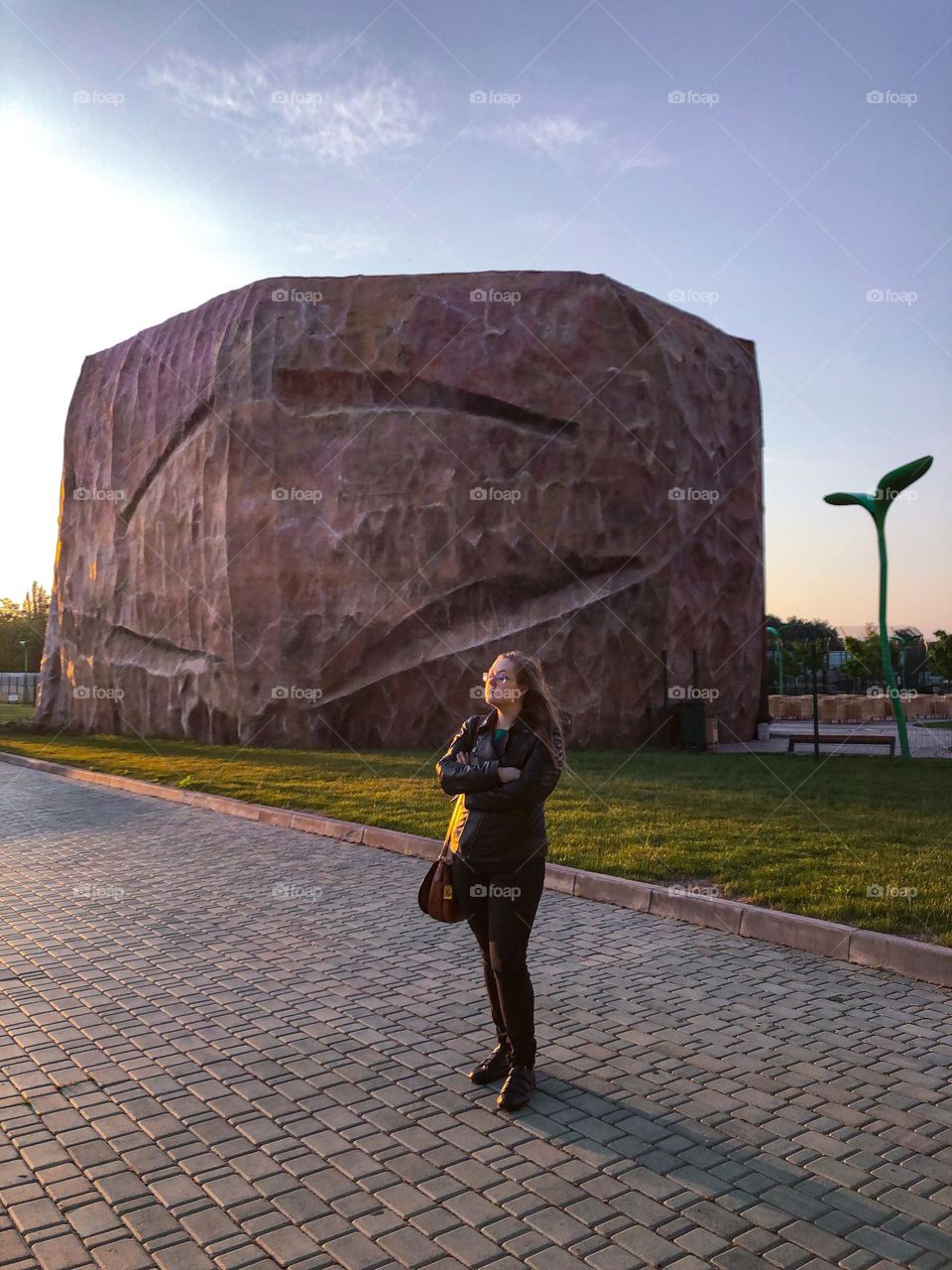 Architecture large stone woman in black