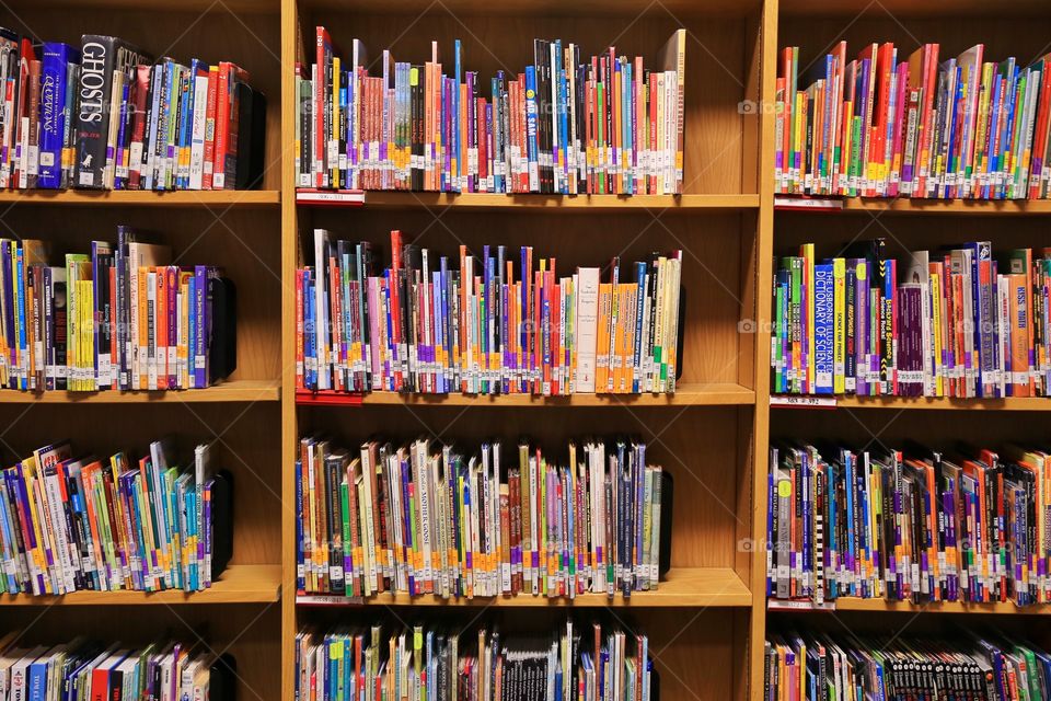 Library at local high school. Books and they way they line up in libraries always get my attention. So colorful, yet full of knowledge. 