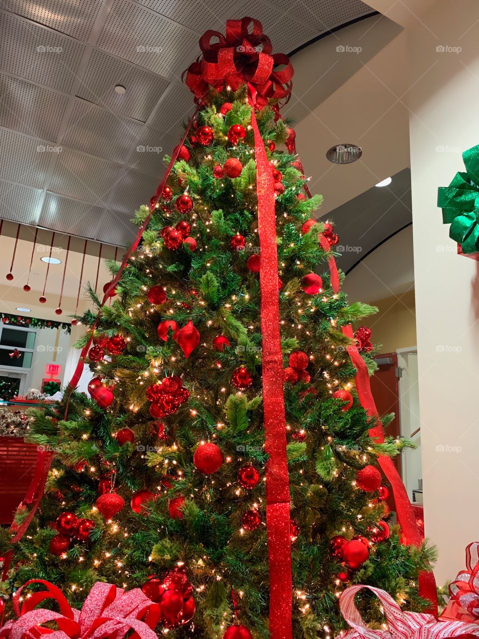 A festive Christmas tree glittering with warm lights and decorations.