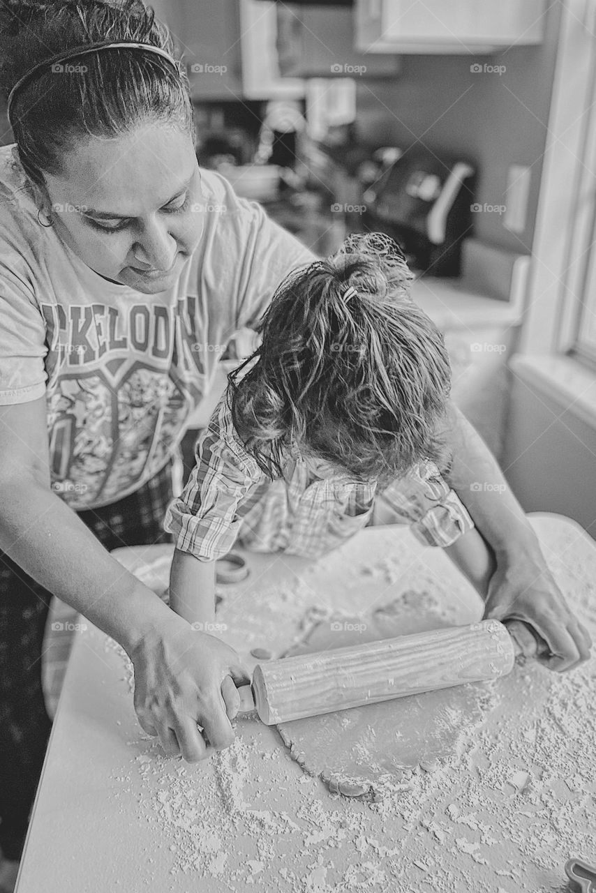 Mother and child rolling out dough to make sugar cookies, making cookies with mommy, making cookies with toddlers, rolling out cookie dough, black and white portrait of mother and child, making homemade Easter sugar cookies 