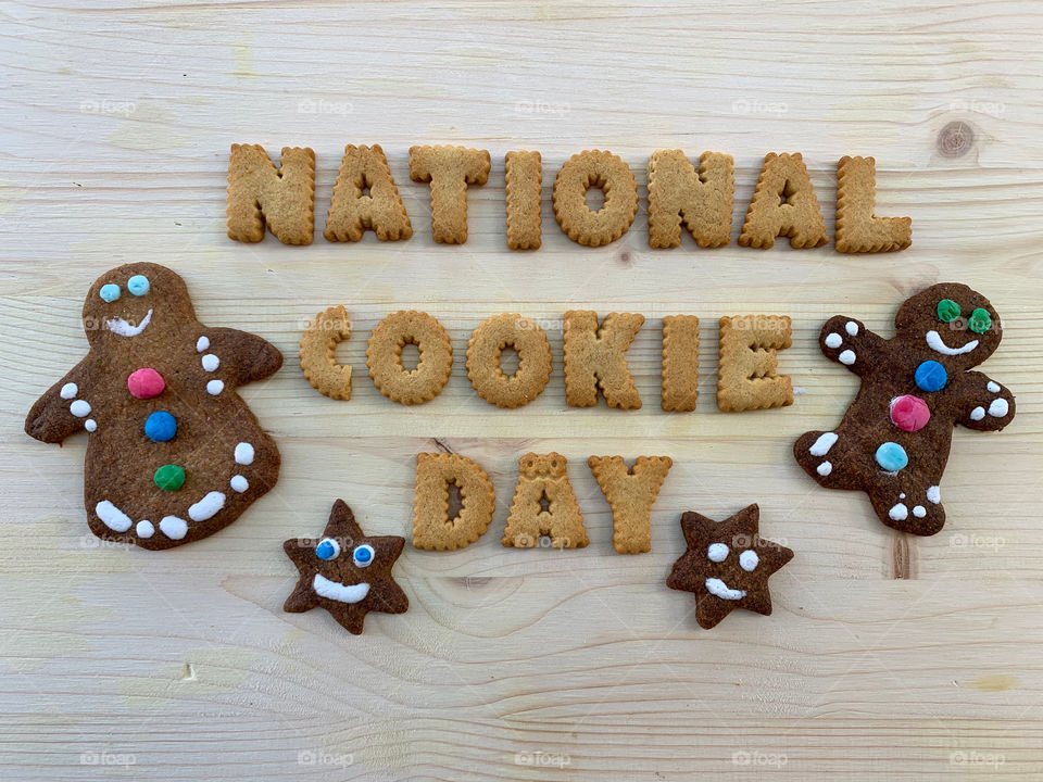 4th December, National Cookie Day Sign composed with cookie letters over wooden board