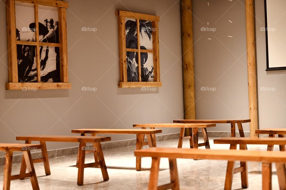 Solitude Amidst Silence, Serene Scenery of Empty Benches in a historic museum Room.