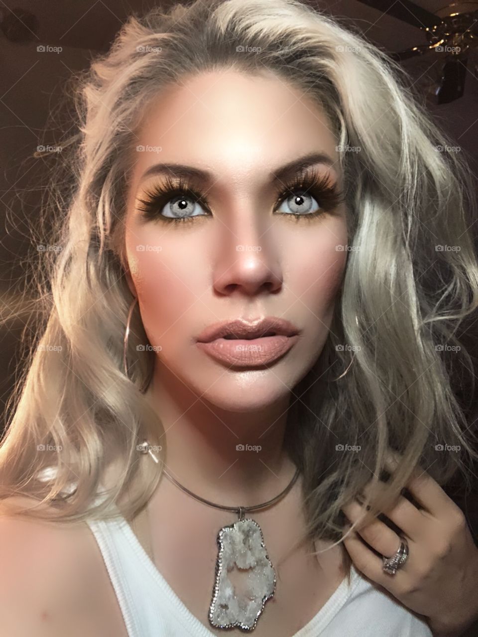 Selfie showing mua skills and Solotica colored lenses with some gorgeous long fluttery lashes.