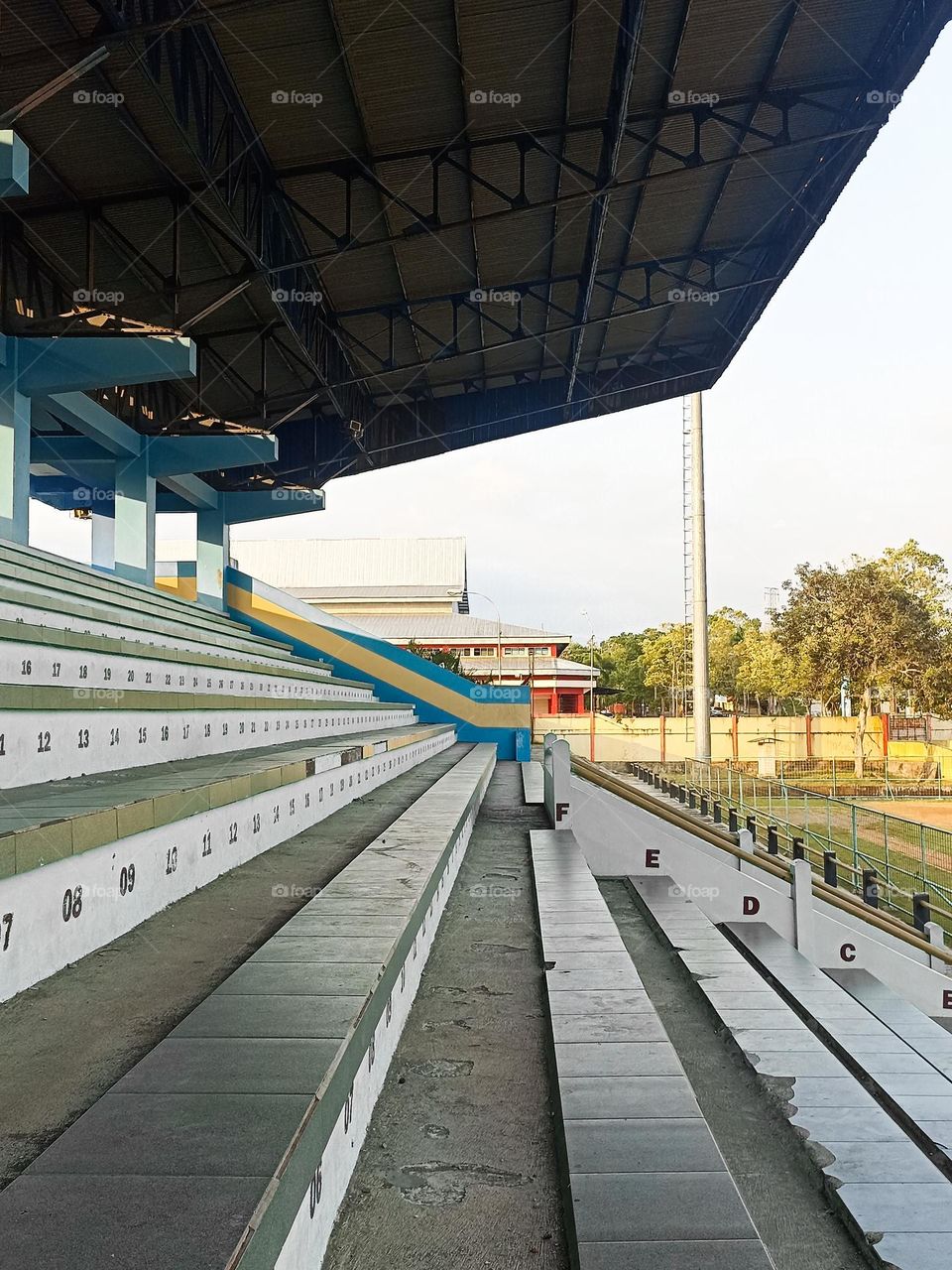 stadium with empty bleachers and clear sky in the background