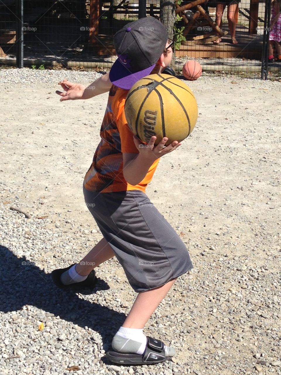 Boy throwing basketball 