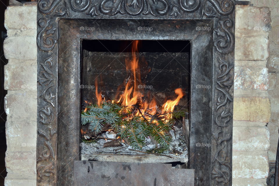 A bright vivid photo of magical fireplace in the country. Christmas time.