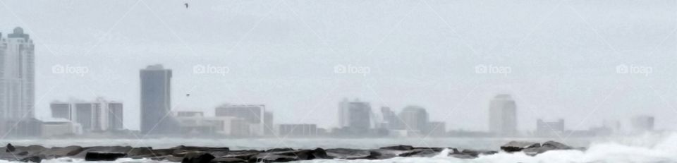Cityscape on a foggy day from an ocean view