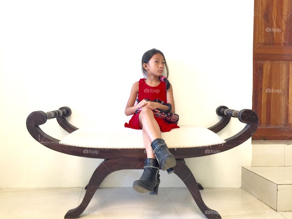 A little girl sitting